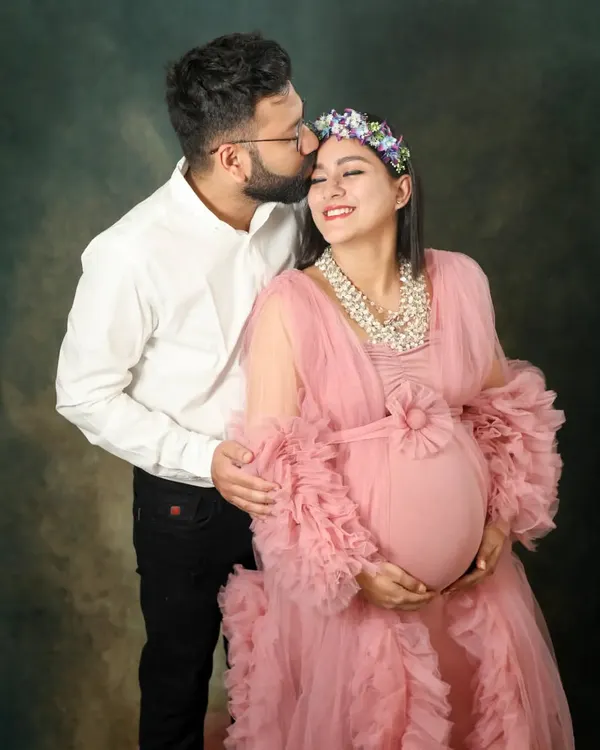 A tender kiss for the glowing mom-to-be. I love using beautiful gowns like this pink tulle one to add a touch of fairytale magic to my studio maternity sessions.