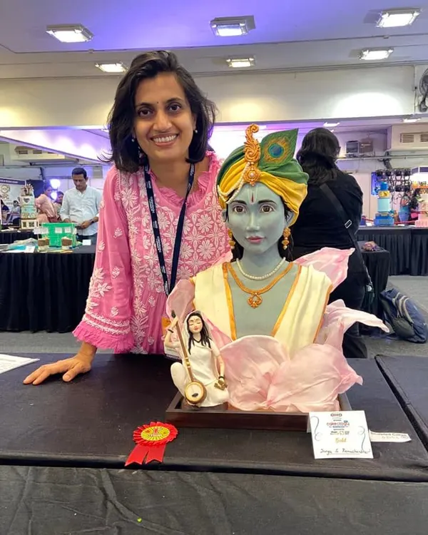 I am on the ninth cloud! This is me with my sculpted Krishna cake after it won the gold medal at Cakeology. Getting such amazing comments from world-renowned judges was an absolute honour.
