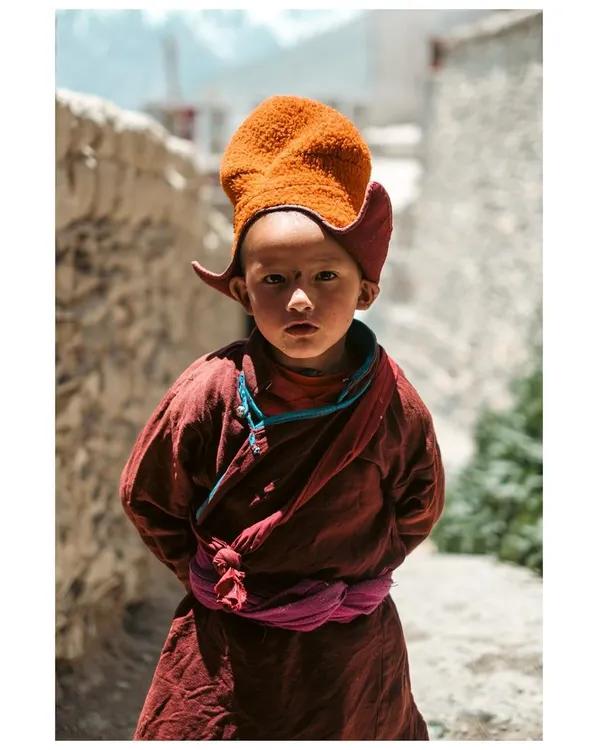 The innocent yet profound gaze of a young monk in Karsha, Zanskar Valley. For me, portrait photography is about connecting with a person's story and reflecting their spirit in a single frame.