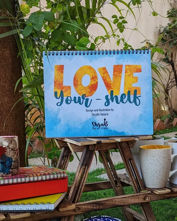 The cover of my 2023 desk calendar, 'Love Your-shelf'. The theme celebrates the little things we collect that bring us joy, from books to plants.