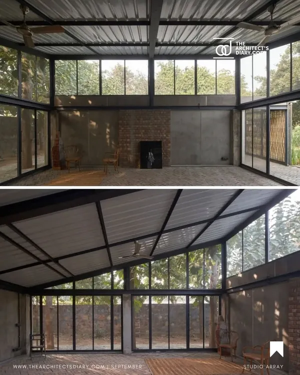 An overview of the Artist Residency in New Delhi, where glass walls and an open structure blur the lines between the living space and the natural landscape, creating a truly organic environment.