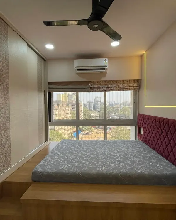A perfect example of a dreamy and functional kids' bedroom. The elevated platform bed not only saves space but also creates a cozy, den-like feel, while the built-in wardrobe offers ample storage.
