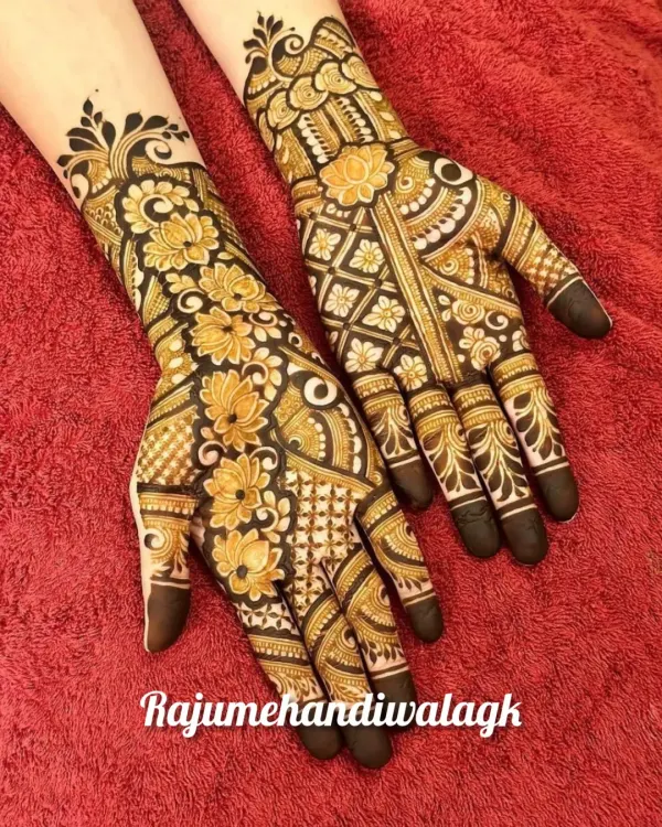 A full and heavy floral design that is perfect for a big festival like Diwali or Teej. The use of negative space makes the flowers stand out beautifully.