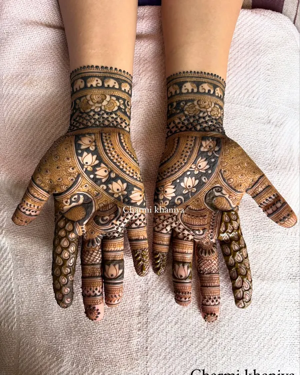 This is my hero design! A stunningly detailed henna piece featuring graceful peacock and lotus motifs. This is the kind of rich, traditional art that is perfect for sangeets, festivals, and any grand celebration.
