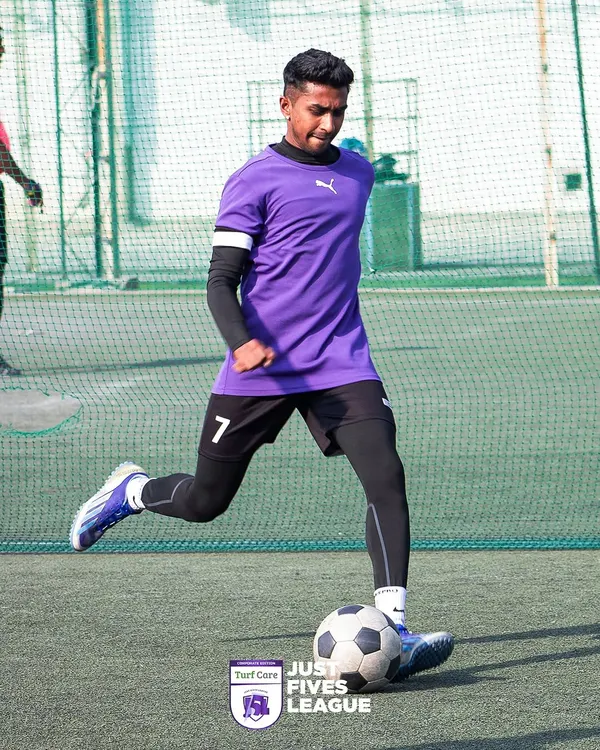 A player dribbles with precision during a Just Fives League match. Our football turf rentals in Bangalore offer consistent, high-performance surfaces for players of all skill levels.