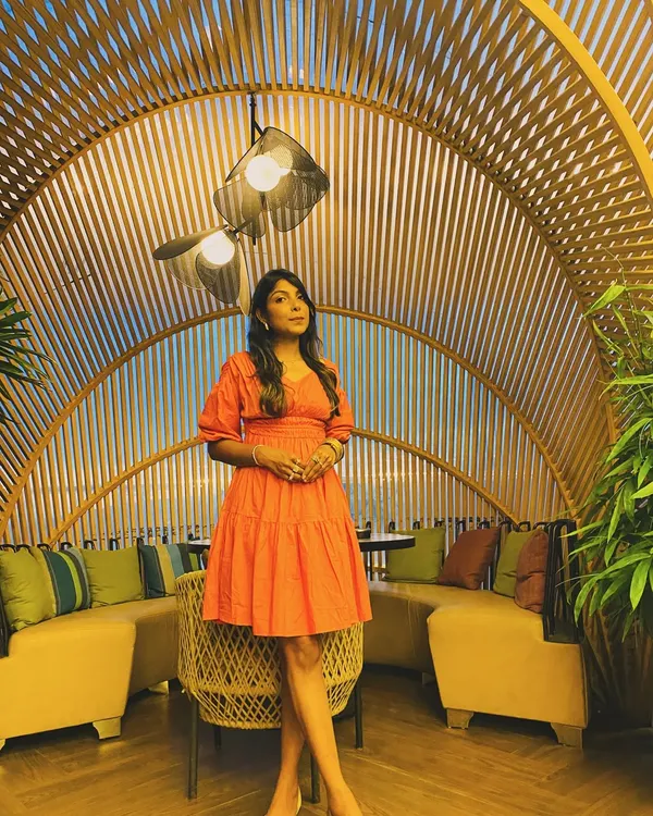 A perfect outfit for a cafe outing. This coral tiered mini dress with puff sleeves is fun, comfortable, and effortlessly stylish.