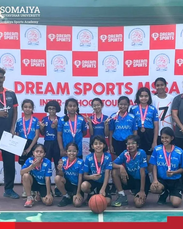 The Somaiya School U-11 Girls Basketball Team shows off their bronze medals after a thrilling victory at the MSSA Tournament.