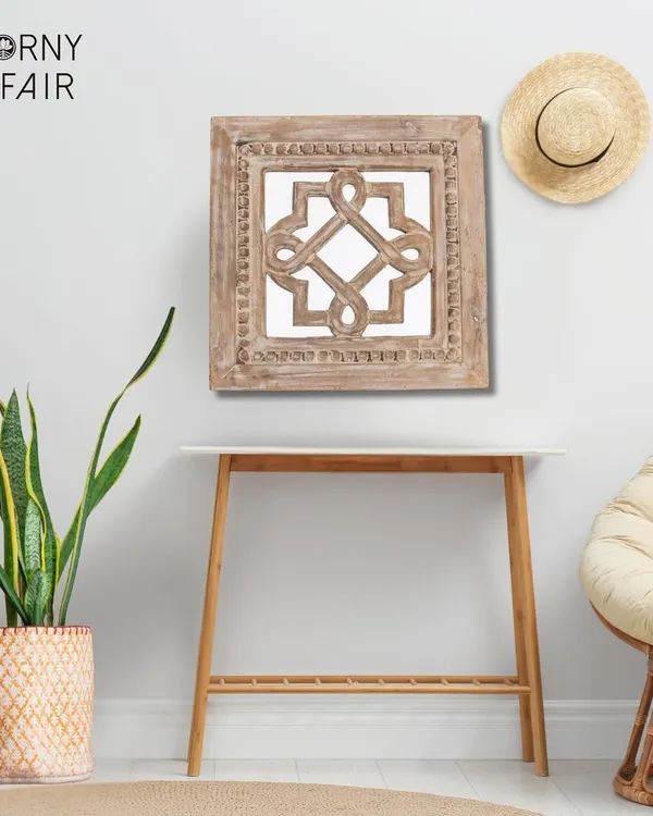 This handcrafted wall mirror, carved from mango wood with a rustic finish, adds a touch of natural charm to your wall. The intricate knot design makes it a unique piece of wall art.