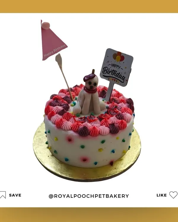 This is the custom cake I made for Coco's birthday. It features delicate frosting work and a hand-molded, edible figure of a dog on top.