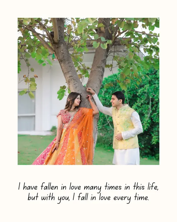 A sweet moment captured under a tree, framed with a heartfelt quote. The couple's colorful outfits pop against the natural greenery, creating a vibrant and romantic image.