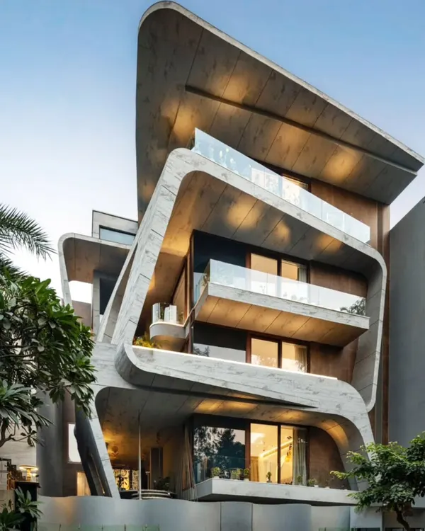 This home is a symphony of concrete and creativity. I designed this facade to be a living sculpture, where fluid lines and bold forms create a home that is as extraordinary to behold as it is to live in.