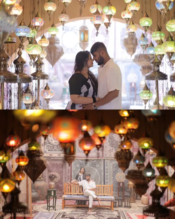 A breathtaking shot of the couple surrounded by a ceiling of glowing Turkish lamps. This image showcases the magic of a themed set, creating a romantic and visually stunning portrait that feels like a scene from a fairytale.
