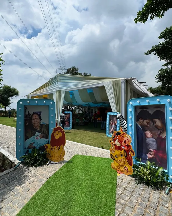 Hakuna Matata! For this first birthday, I created a Lion King theme, lining the entrance with large, framed family photos and cutouts of beloved characters like Simba and Pumbaa.