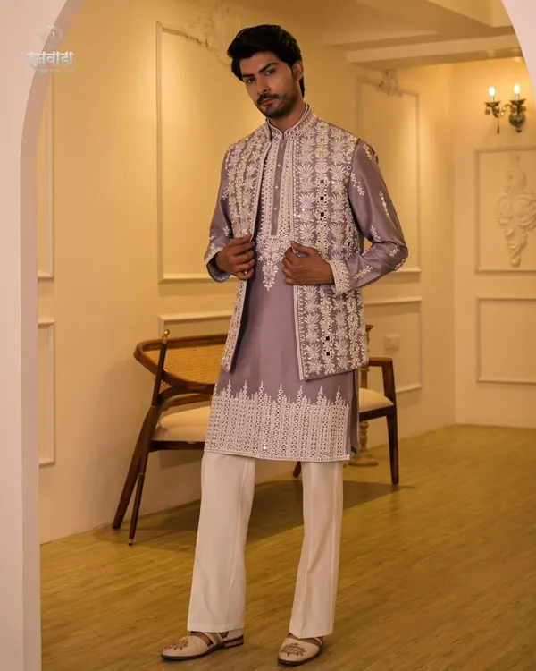A full-length view of the lilac Indo-Western set, complete with a mirror-work jacket, matching kurta, and white trousers. This outfit is a perfect choice for a Sangeet or a destination wedding.