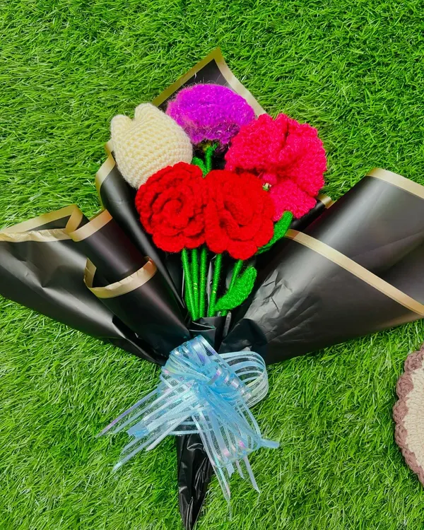 A beautiful handmade crochet bouquet, featuring a mix of vibrant flowers, professionally wrapped and ready for gifting. This is a perfect, lasting present for any occasion.
