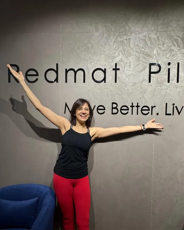 This is me, Taru, in my element. I am so proud of the joyful and empowering space we have created at RedMat Pilates, a place to move better and live better.