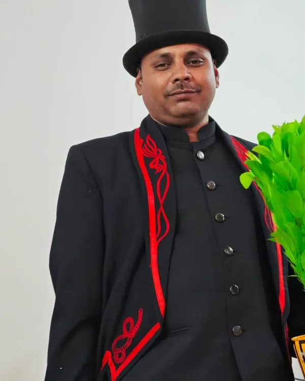 Dressed in my classic magician's attire, complete with a top hat and a colorful feather bouquet prop. I am always ready to bring a touch of showmanship and wonder to your event.
