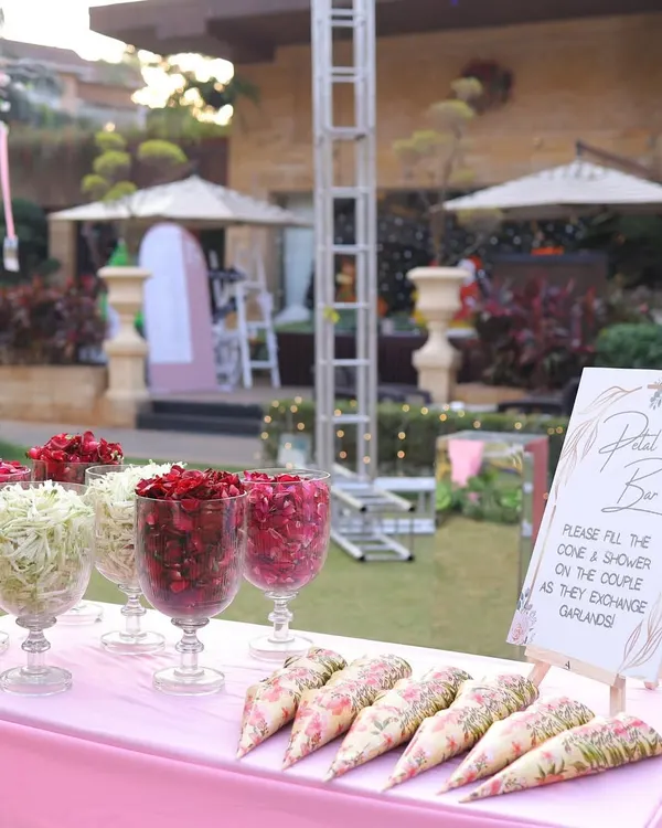 A 'Petal Bar' for guests to shower the couple with blessings as they exchange garlands. It's a small touch that involves guests in the ceremony.
