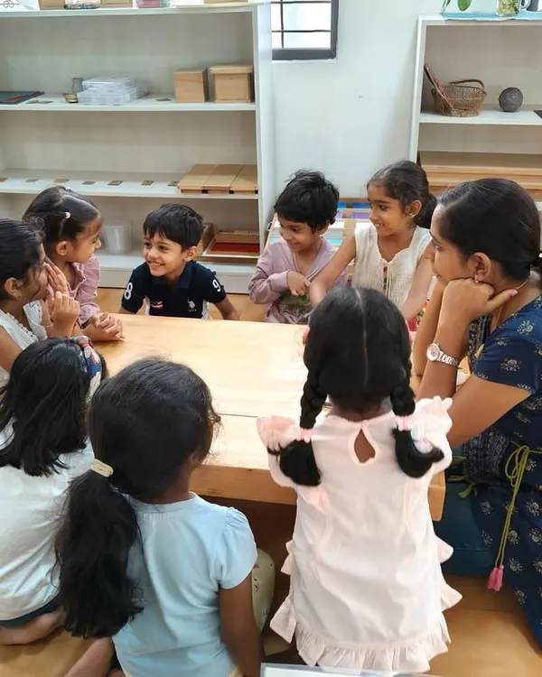While individual learning is key, purposeful group time is also important. Here, children gather for circle time, learning to take turns, listen to their peers, and feel a sense of belonging.