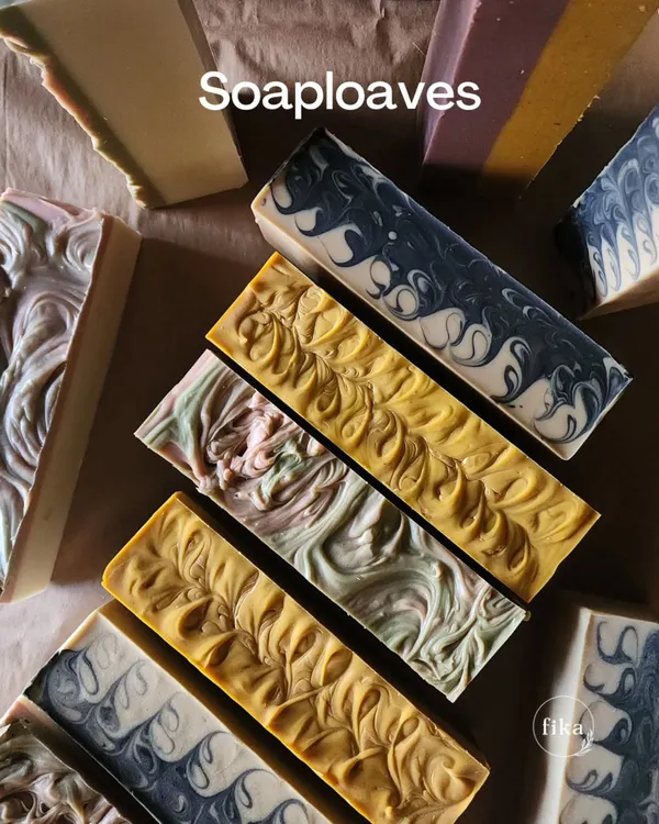 A beautiful collection of my finished soap loaves. You can see the variety of natural colors and intricate swirl patterns I create. These are ready to be cut into individual bars for my wholesale and private label partners.