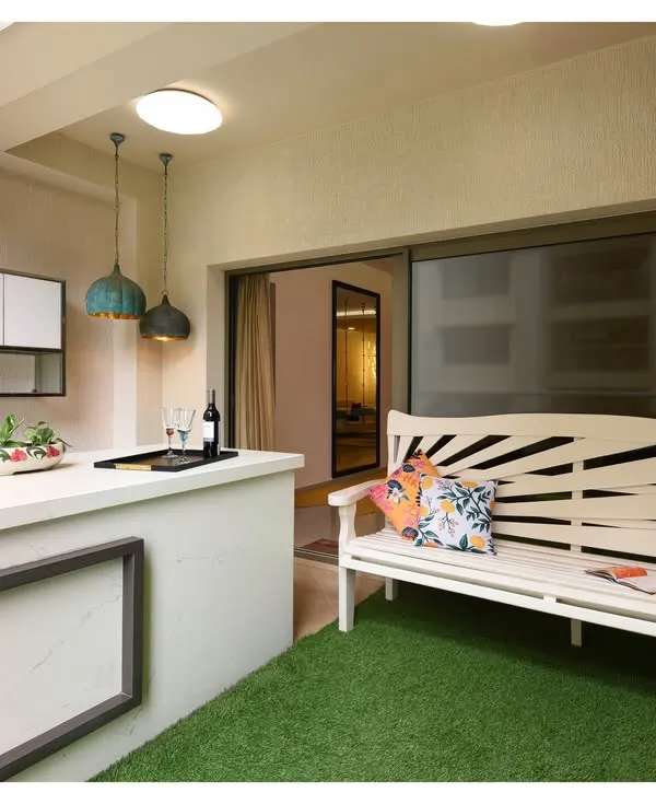 This stylish outdoor bar unit transforms a backyard into a chic hangout spot. It's the perfect setup for sunset cocktails or weekend barbecues, blending beauty with practicality for the ultimate outdoor entertaining experience.