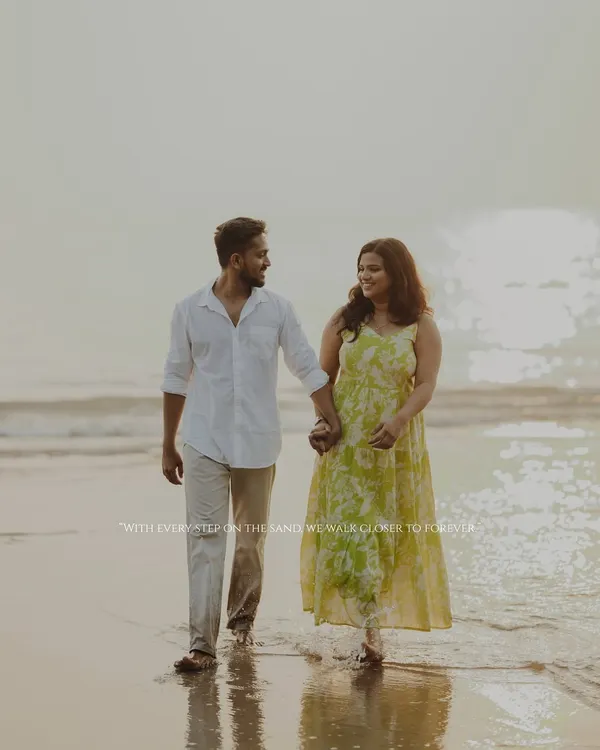 With every step on the sands of Alibaug, we walk closer to forever. A beautiful, candid shot of a couple enjoying a romantic pre-wedding walk along the shoreline.