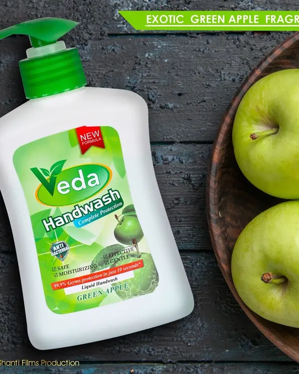 For this handwash, we created a lifestyle product shot using fresh green apples and a dark wood background to visually communicate its "Green Apple" fragrance and natural feel.