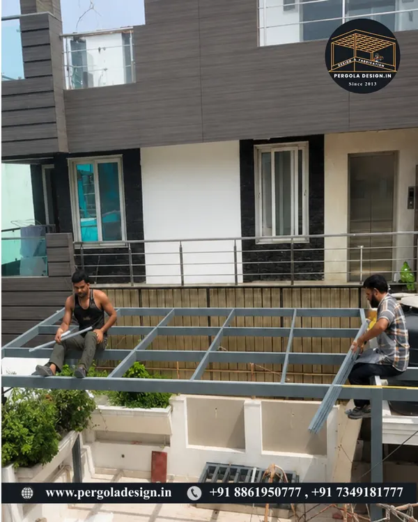 This image captures our team during the crucial framework installation phase. It shows the heavy-duty mild steel structure being assembled on-site, forming the robust skeleton for a future glass pergola.