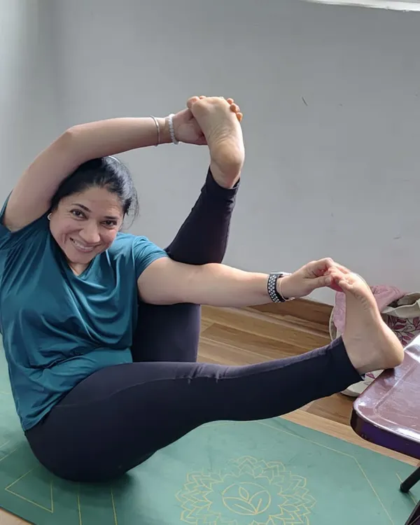 A happy student in a deep hip-opening pose during our Sunday workshop. The smile says it all. Practice should bring joy, even when it's challenging.