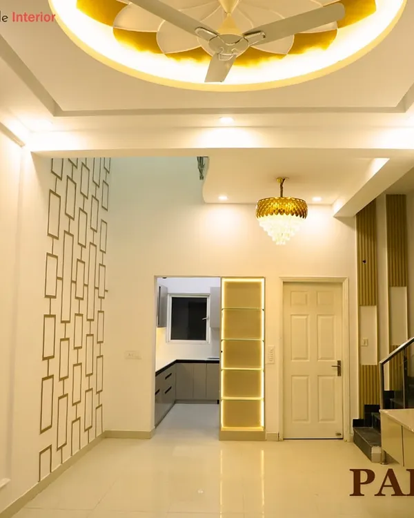 A glimpse into a royal-themed interior, showcasing a grand hallway with intricate wall patterns and a beautiful flower-shaped ceiling design.
