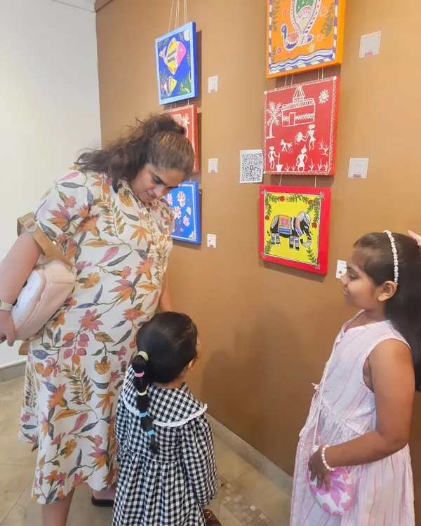 Proud moments from our student exhibition. Here, our young artists are explaining the stories behind their traditional Warli and Madhubani artworks to visitors.