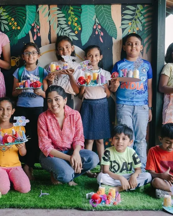 A group of proud artists from our summer art camp, showing off the 3D dioramas they created. We focus on the entire creative process, from initial idea to the final showcase for families.