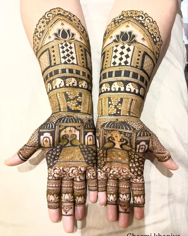 A truly royal mehendi design! I've included beautiful palace jharokhas, blooming lotuses, and a parade of tiny elephants. This is perfect for a bride who wants to feel like a queen on her wedding day.