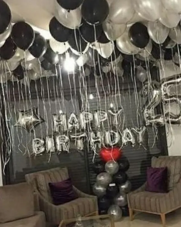 A modern and stylish 25th birthday celebration using a silver and black color scheme. I include large number foils to mark the milestone age, along with a 'Happy Birthday' banner and coordinated balloon arrangements.