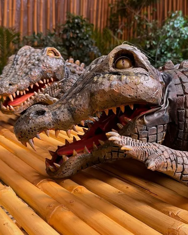 A close-up of the crocodile puppets created for the 'Phir Aayi Haseen Dilruba' promotion on Netflix. The detailed scaling, teeth, and lifelike eyes are crucial for making the creature believable on camera.