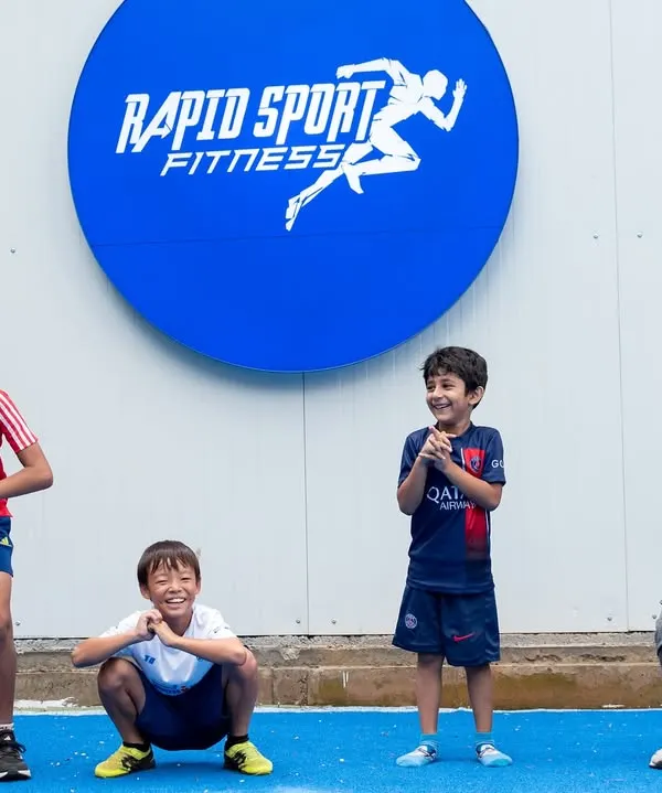 Fun is a key ingredient in our youth programs. Here, our young athletes are all smiles while practicing squat-hold positions at our Jayamahal center. We build foundational strength and proper form in a way that feels like play, ensuring kids stay engaged and motivated.