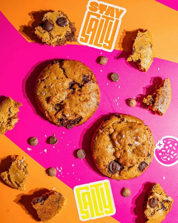This is our (C)lean Cookie. It's a great example of how less can be more, made with just tahini, almond flour, jaggery, and 54% couverture chocolate buttons.