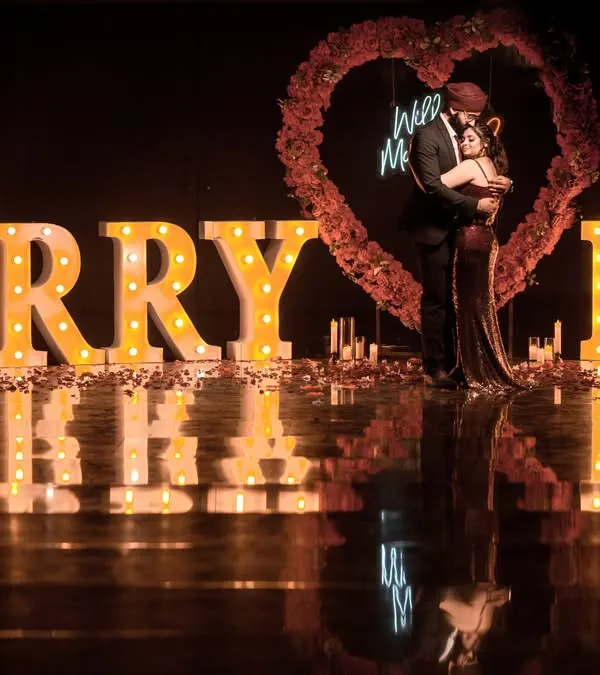A grand proposal setup with "MARRY ME" marquee letters, creating a spectacular and unforgettable scene.