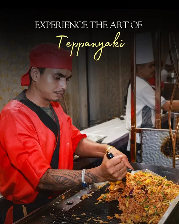 Here is one of my chefs showcasing the art of Japanese Teppanyaki. This live station brings the thrill of the grill to your event, where fresh ingredients are cooked with flair, providing both a delicious meal and a captivating performance.
