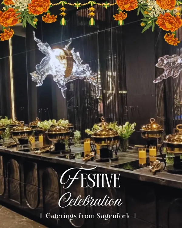 A festive buffet celebration setup, perfect for Rakhi or Diwali. The elegant arrangement features our signature brass chafing dishes, keeping dishes like Navratan Korma and Dal Makhani warm and ready for your guests to enjoy.
