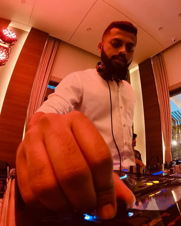 It all comes down to the details. This low-angle shot gives a close-up of my hand on the Pioneer mixer, tweaking the sound to perfection. Every adjustment is about building the next wave of energy for the crowd.
