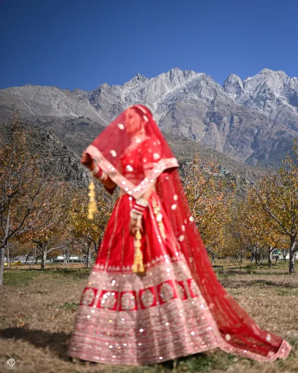 This is the kind of moment I live to capture. A bride, standing against the majestic Kinnaur mountains, ready to begin her new life. For me, destination wedding photography is about making nature a part of your story, creating a frame that is as grand as your love.