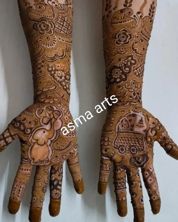 A sweet baby shower mehendi design, complete with a baby elephant on one palm and a pram on the other to celebrate the new arrival.