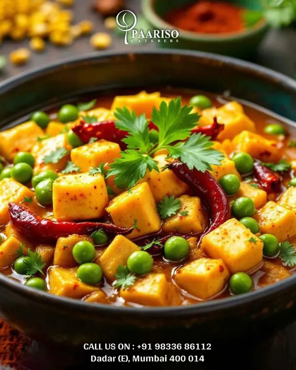 A classic Matar Paneer, featuring soft cubes of paneer and sweet green peas in a rich, tomato-based gravy. This comforting and flavorful dish is a staple in our North Indian vegetarian menu for weddings and family functions.