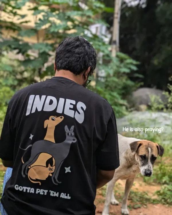 This image captures everything we are about. Here I am, wearing our "INDIES GOTTA PET 'EM ALL" t-shirt, sharing a quiet moment with a community dog. This is why we do what we do; to foster moments of connection and advocate for our streeties.