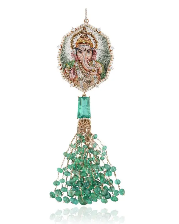 This micromosaic pendant of Lord Ganesha is handcrafted in 18k gold with Zambian emeralds and natural diamonds. The back is etched with the Vakratunda Mahakaya shloka, chanted to banish obstacles and invite prosperity.