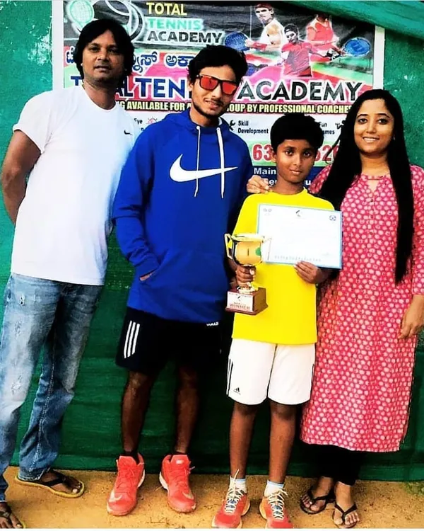 A proud moment for our academy as our champion Likhith celebrates his tournament win with his parents and me. We host in-house tournaments to give our players valuable match experience.