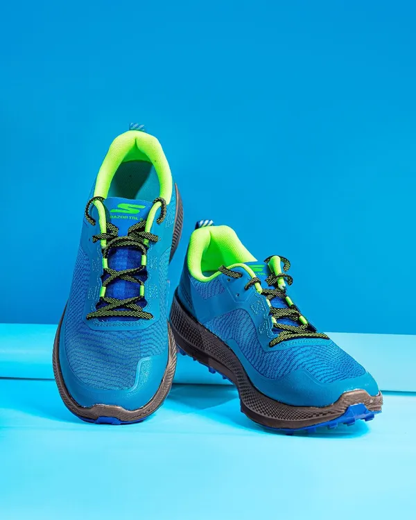 A front-on studio shot of Skechers Go Run shoes against a solid blue background. This angle provides a clear and direct view of the shoe's design, ideal for product listings and web banners.