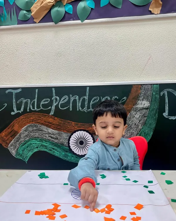 A young patriot carefully creates the Indian flag using paper collage. This Independence Day activity helps develop fine motor skills while teaching about our national symbols.