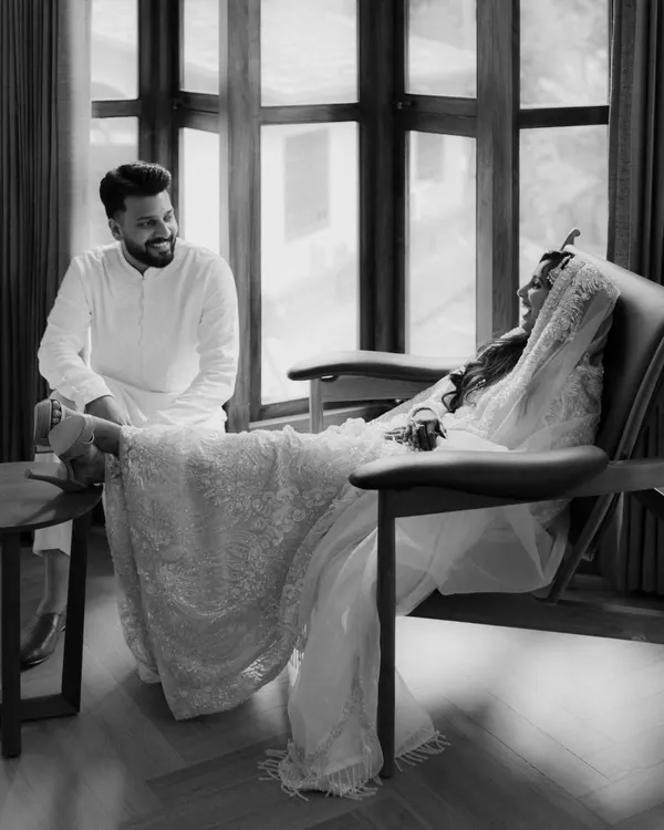 A quiet moment of connection during Sana and Naveed's Nikah. His smile as she rests is a perfect example of the candid, heartfelt interactions I seek to capture, telling a story of comfort and love.
